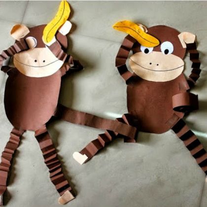 two monkey puppets made out of toilet paper