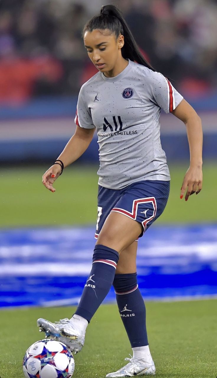 a female soccer player in action on the field