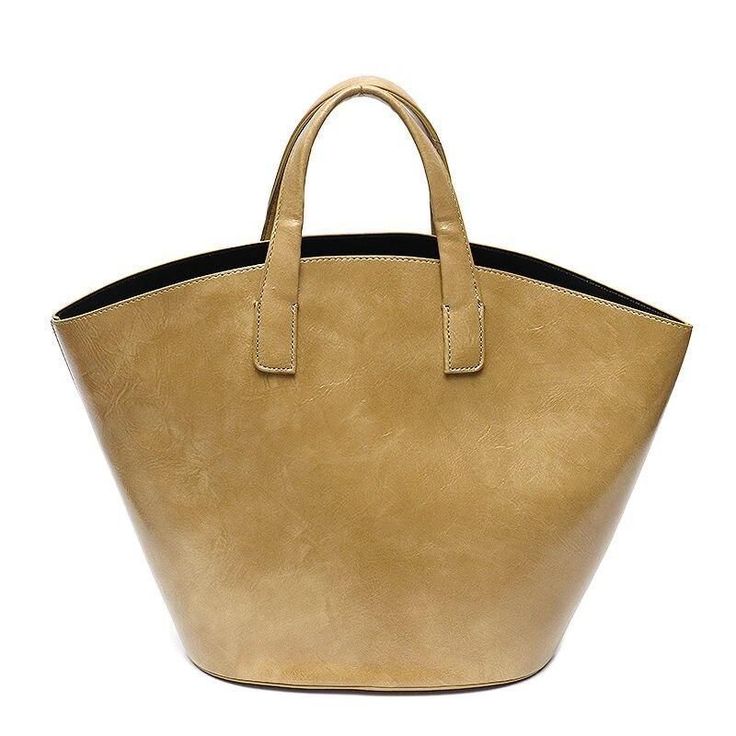 Discover Everyday Elegance Step into the world of sophistication with our Elegant Vegan Leather Tote Bag, a perfect blend of style and functionality. Crafted for the modern woman, this bag is not just an accessory; it's a statement. Whether you're heading to work, a casual outing, or a special event, this tote bag will elevate your style with its simple yet chic design. Product Features Our tote bag stands out with its unique bucket shape, offering a fresh take on the classic tote design. The bl Elegant Tan Tote Shoulder Bag, Elegant Cream Tote Bag With Gold-tone Hardware, Light Brown Leather-handled Bucket Tote Bag, Cognac Shoulder Bag Tote With Gold-tone Hardware, Cognac Tote Shoulder Bag With Gold-tone Hardware, Vegan Leather Tote Bag, Vegan Leather Tote, Bag Stand, Shopping Trip