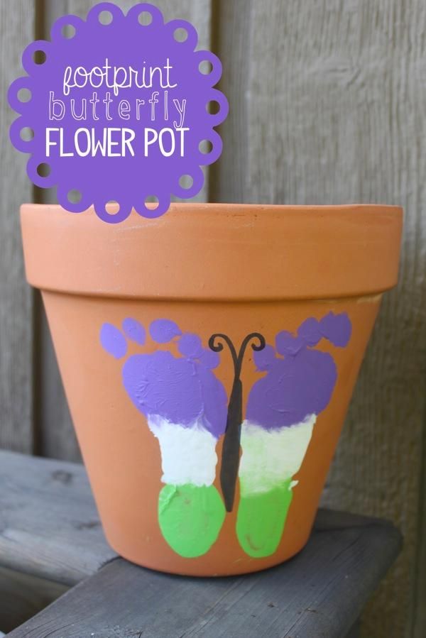 a flower pot painted to look like a butterfly