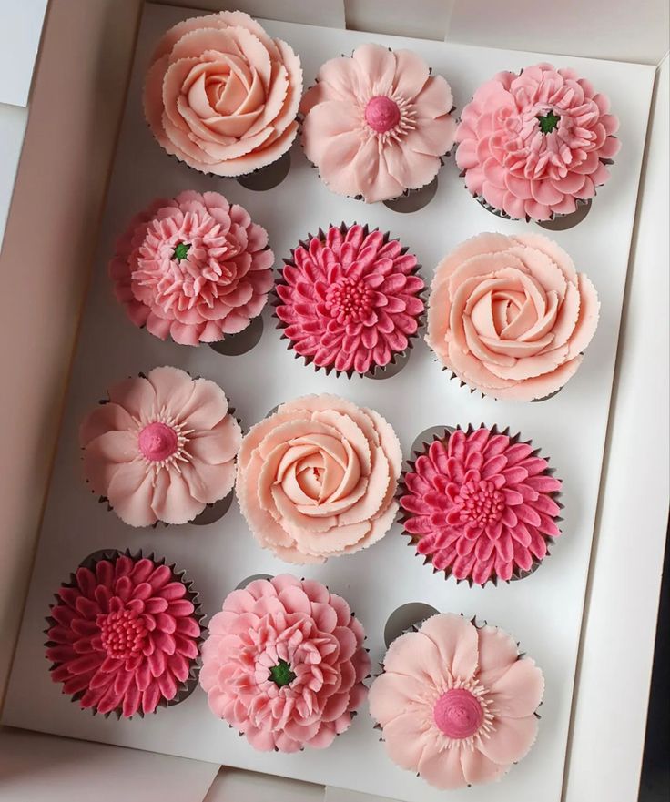 cupcakes in a box decorated with pink flowers