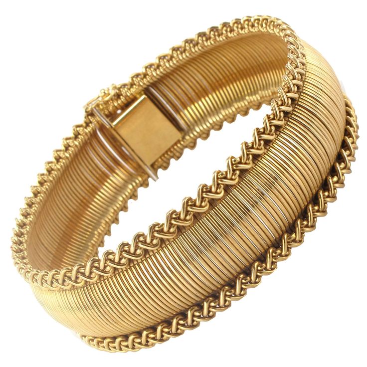 Bracelet in 18 carat yellow gold, rhinoceros hallmark. The mesh resembles golden baize edged with gold braid. The clasp is a ratchet with a safety ‘8’. Length: 19 cm, width: 2 cm. Total weight : 50.4 g approximately. Authentic vintage bracelet – French work - a unique piece, created in the 1950s. Our opinion : A timeless mesh, of high quality and extremely elegant that ensures this piece of jewellery will never go out of fashion. Specialized in antique and creation jewelry since 1975, we deliver Gold Woven Bracelet, Jewellery Photography, Diamond Bangles, Retro Bracelet, Adjustable Bangle Bracelet, The Bangles, Bracelets Design, Antique Bracelets, Bride Jewelry