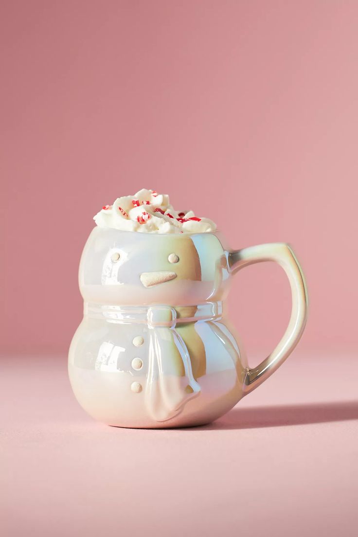 a ceramic mug with marshmallows in it