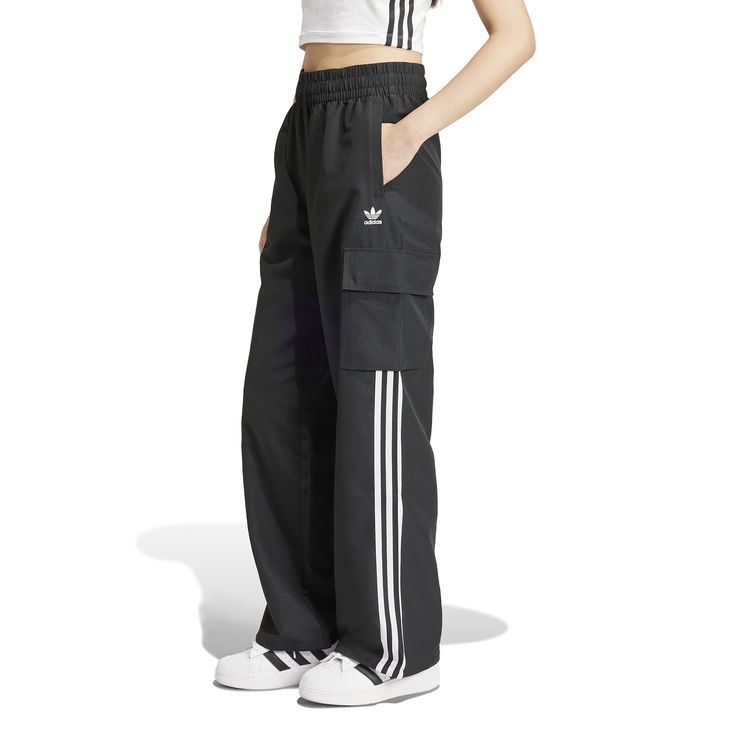 Wide legs make for comfortable days... The adidas Wide Leg Women's Cargo Pants give you plenty of room to move, along with handy cargo pockets to store your belongings. And with the iconic adidas stripes down the side, you can get the comfort and classic style the brand is known for.Features adidas three-stripe design. Relaxed fit. Elastic waistband. Features two cargo pockets. Material: 100% Polyester. Consists of at least 40% recycled materials. Contains 50% Parley Ocean Plastic. Women's Cargo Pants, Cool Vibes, Adidas Three Stripes, Utilitarian Style, Black And White Sneakers, Move Along, Cargo Pant, Cargo Pants Women, Nike Tees