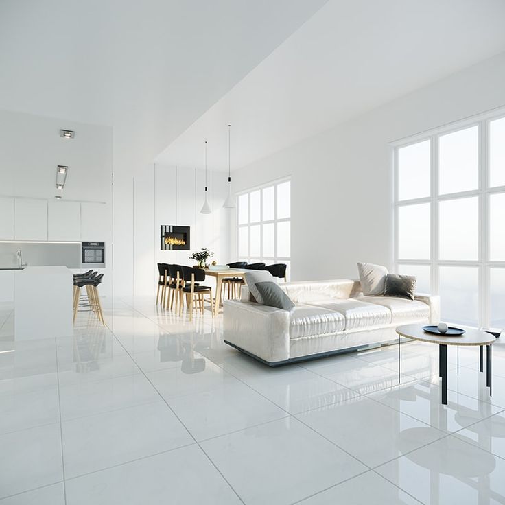 a living room filled with furniture and white walls