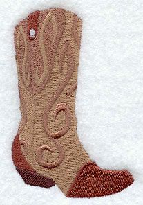 a pair of brown boots sitting on top of snow covered ground