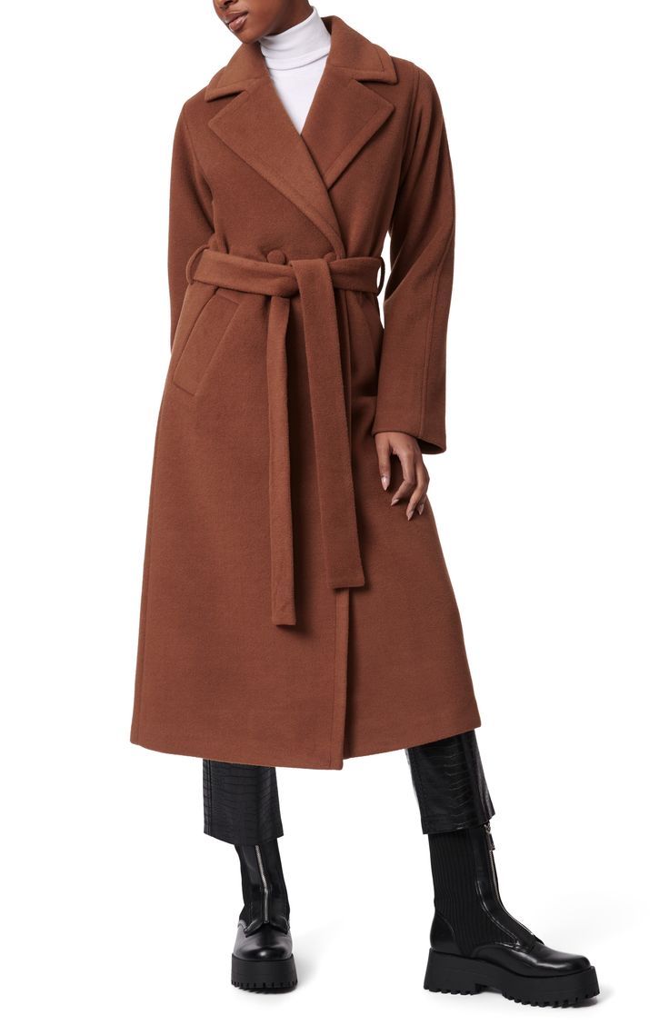 Wool-kissed double-face fabric brings cozy comfort to this lengthy belted coat crafted in a double-breasted silhouette framed with notched lapels. 47" length (size medium) Double-breasted button closure Notched lapels Front welt pockets Removable tie belt Lined 86% polyester, 7% wool, 7% rayon Dry clean Imported Chic Long Belted Outerwear, Long Wool Coat With Belted Cuffs For Spring, Belted Long Coat For Work, Belted Wool Coat With Lapel Collar For Spring, Fitted Wool Coat With Belted Cuffs For Fall, Chic Outerwear With Self Belt And Notch Lapel, Long Belted Outerwear For Work, Spring Long Coat With Self Belt, Fitted Pea Coat With Belted Cuffs For Fall