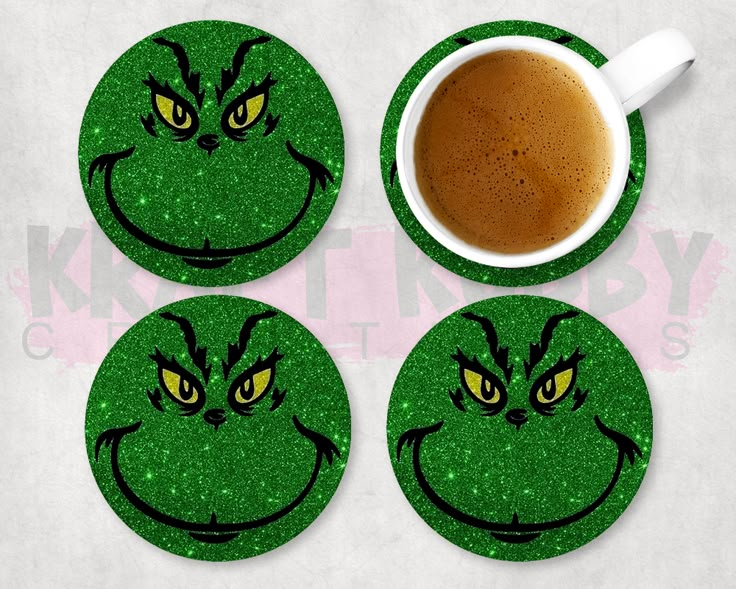 the grin face coasters are next to a cup of coffee