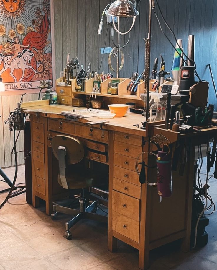 a wooden workbench with many tools on it