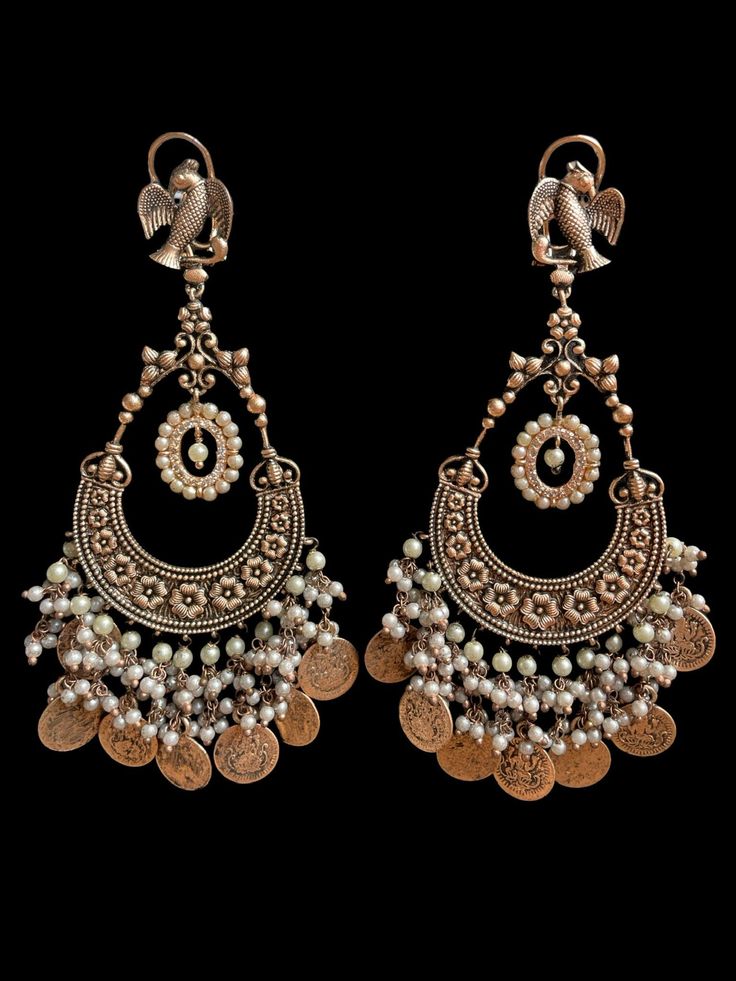 These oxidized earrings come in two beautiful colors with an antique gold finish to complete the royal look. They are very comfortable to wear and the colors are subtle with antique gold work to not overpower the look of the statement earrings. Bohemian Dual-tone Earrings For Festivals, Brass Temple Jewelry Jhumkas, Gold Dual-tone Brass Earrings, Brass Temple Jewelry Chandelier Earrings For Festivals, Temple Jewelry Kundan Earrings With Oxidized Finish, Festive Bohemian Dual-tone Earrings, Antique Gold Earrings With Intricate Design For Festive Occasions, Oxidized Temple Jewelry Jhumkas, Bohemian Dual-tone Earrings For Weddings