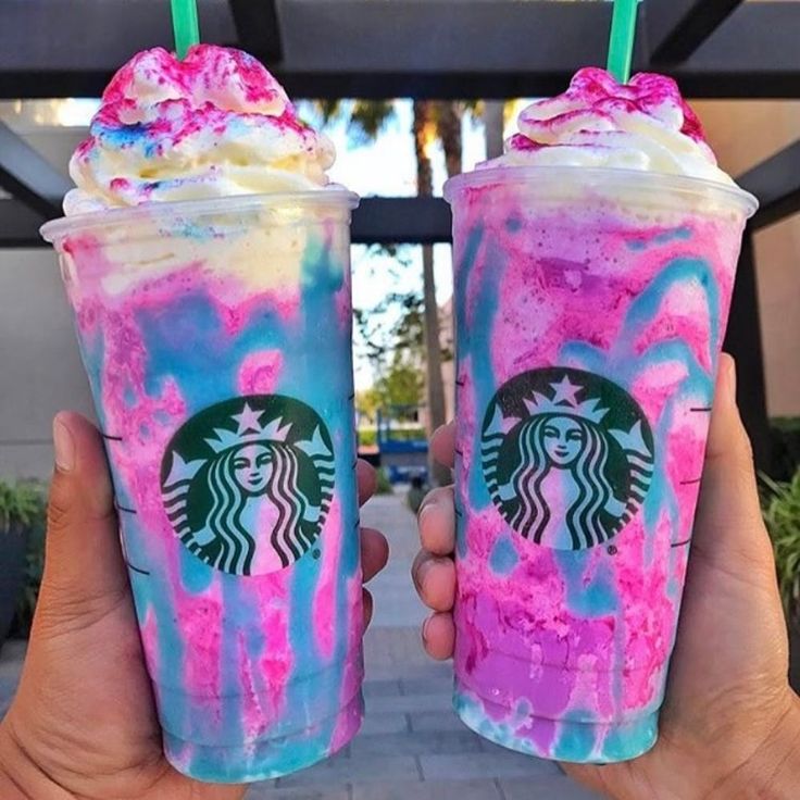 two starbucks drinks with pink and blue swirled toppings