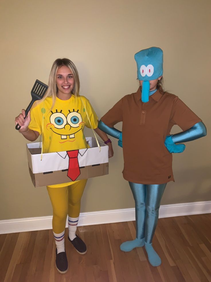 two people dressed up as characters from the spongebob movie holding spatulas