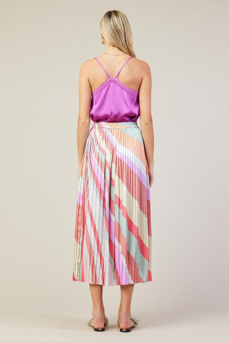 This pleated midi skirt hosts a swirl of diagonal stripes in pastel hues. The style has tons of movement, plus an elasticized back waist for added comfort. •Pull-on style •Elasticized back waistband •Pleated Item Number: 53358 100% POLYESTER Vacation Dresses Casual, Wedding Guest Dress Trends, Vacation Looks, Casual Wedding Dress, Fall Layers, Diagonal Stripes, Pastel Hues, Vacation Dresses, Pleated Midi Skirt