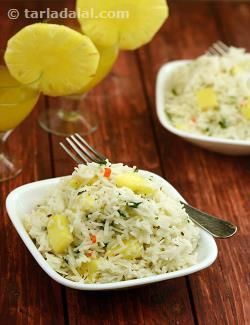 two white bowls filled with rice and pineapples