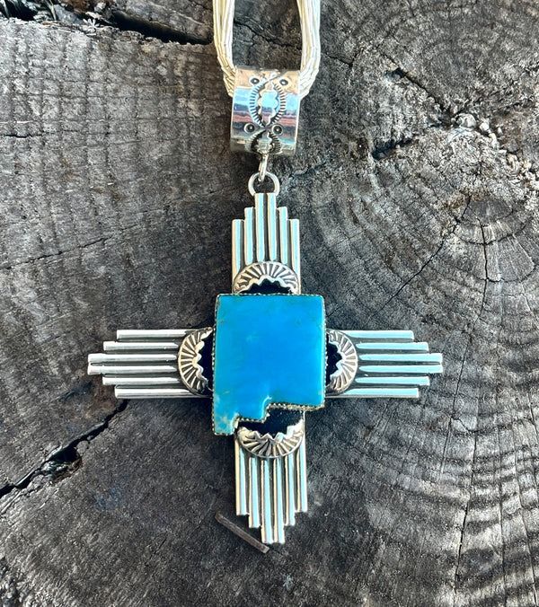 Charlene Yazzie Zia symbol pendant. Offered in Agave Green, Blue, and White Buffalo. Made right here in New Mexico! made with .925 silver and Native American Handmade.