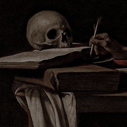 a skull sitting on top of a table next to an open book and a pen