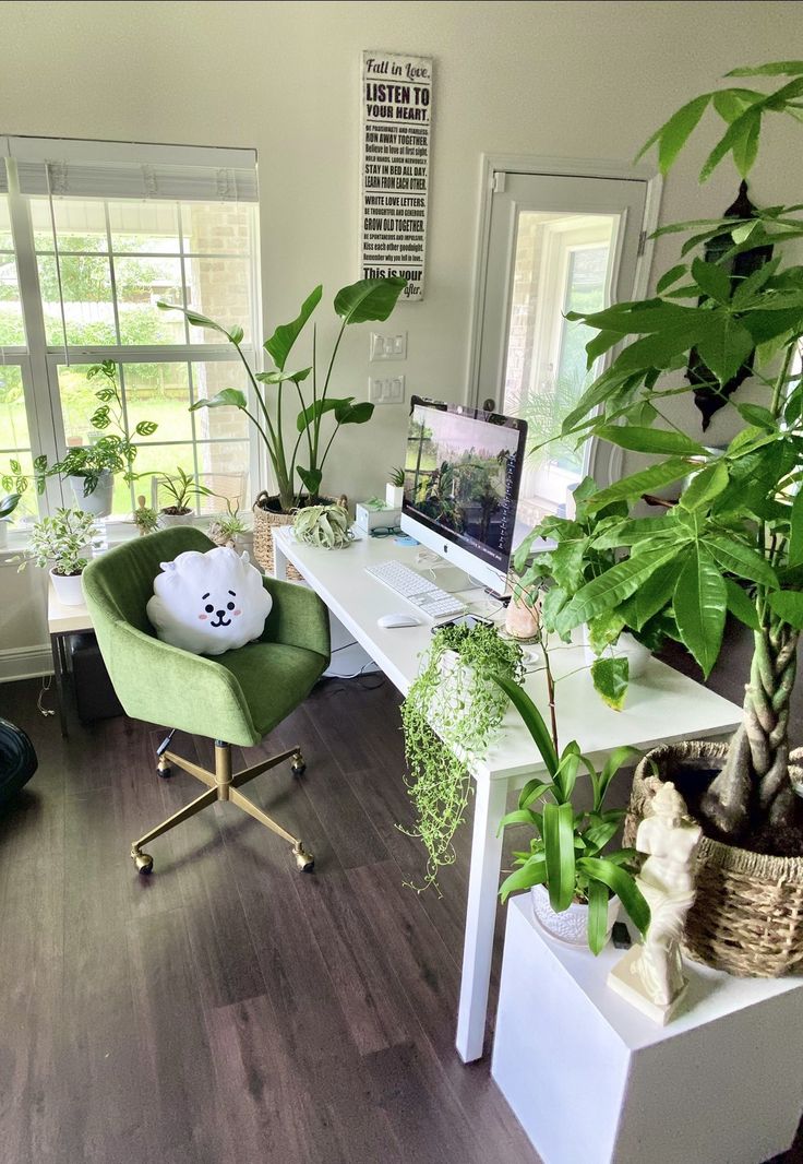 a living room filled with furniture and lots of plants on top of it's desk