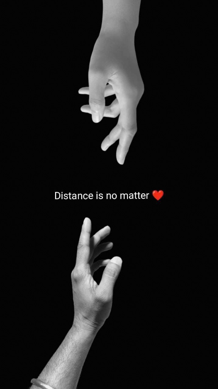 two hands reaching towards each other with the words distance is no matter