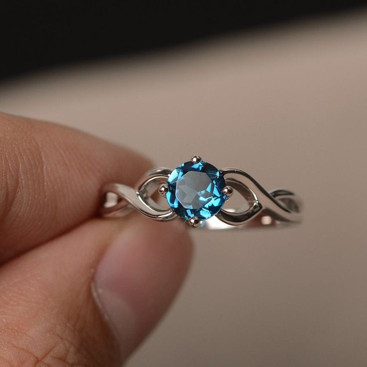 This is a gorgeous handmade creation. Its beauty is its simplicity & Elegance. The 6*6 mm round cut London blue topaz is crafted in solid sterling silver and with rhodium plated. All item is sent in a beautiful gift box You can realize more lovely stuff clicking the link https://www.etsy.com/shop/knightjewelry?refshopsection_shophome_leftnav Please leave the correct address and you phone number for delivering successfully. Engagement Ring Blue Stone, Rainbow Topaz Ring, Blue Topaz Rings, London Blue Topaz Engagement Rings, Topaz Rings, Mystic Topaz Ring, Blue Topaz Engagement Ring, Ebay Business, Rings Sterling Silver