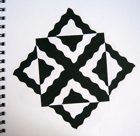 a black and white pattern on a spiral notebook