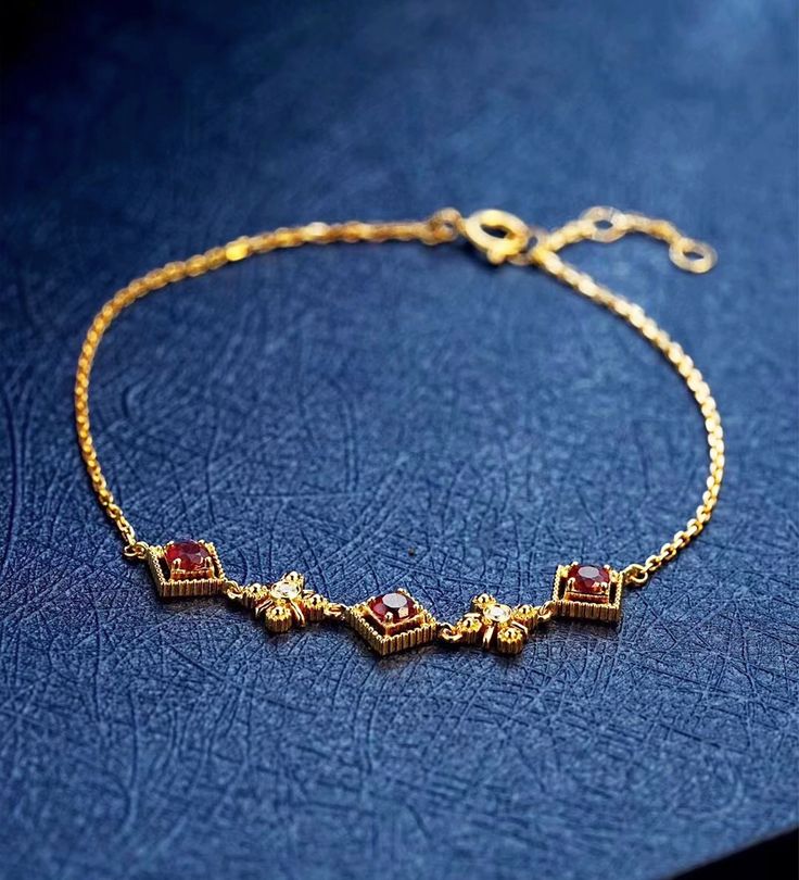 Red Zircon Bracelet, Gold Bracelet with Red Zircon, Minimalist Bracelet, 14K Gold-Plated, Dainty Bracelet, Delicate Bracelet This delicate red zircon bracelets are a must have for every girl!  Material: Zircon, 14k gold-plated. Zircon Size：5mm. Bracelet Length: 14cm+3cm extender.  * Feel free to contact me if you have any question please! Elegant Red Chain Bracelet With Jubilee Design, Elegant Red Chain Bracelet For Gift, Elegant Red Jubilee Chain Bracelet, Elegant Red Bracelets With Adjustable Chain, Red Diamond Bracelet As Gift, Red Diamond Bangle Bracelet Gift, Red Diamond Bracelet Gift, Red Gold Jubilee Bracelet For Gift, Red Jubilee Gold Bracelet Gift