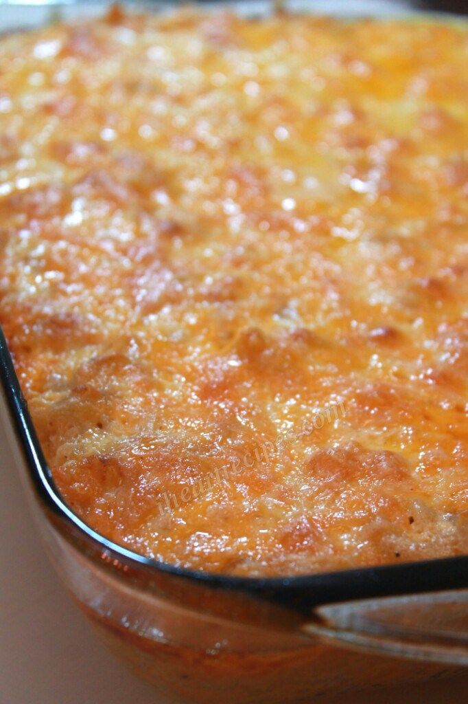 a casserole dish is shown with a spoon in it