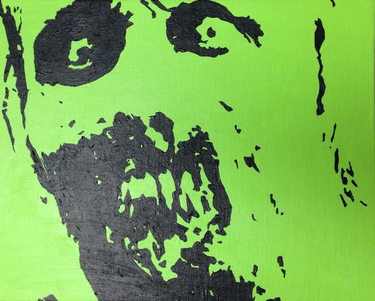 an image of a man's face painted in black and green