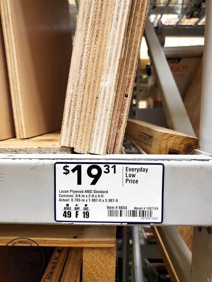 a pile of wood sitting on top of a shelf in a store next to other items