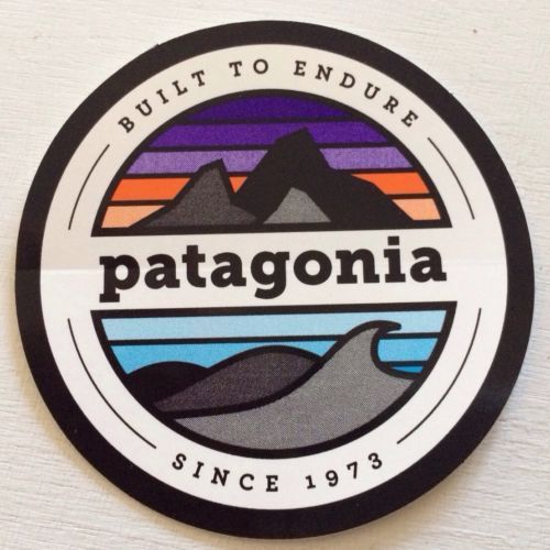 the badge for patagonia is shown in black and white with an orange, blue,