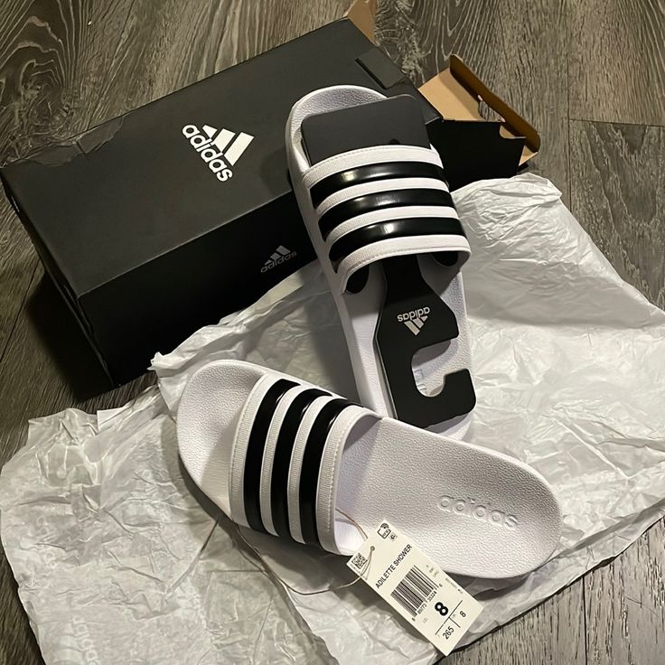 Adidas Adilette Shower White Sandals Us Size 8 (Men) , Fits 9 In Women *Shipped W/ Box *New Adidas White Sporty Slides, Adidas White Flip Flops For The Beach, Adidas White Flip Flops For Beach, White Adidas Flip Flops For The Beach, Adidas White Slip-on Sandals, White Adidas Flip Flops For Beach, White Non-slip Adidas Slides, White Comfortable Adidas Slides, Adidas White Slide Sandals