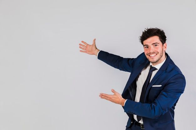 a man in a suit and tie is holding his arms out to the side while smiling