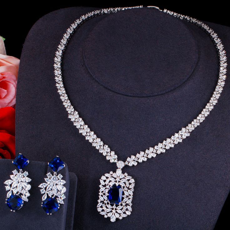 Elevate your ensemble with this beautiful Light Blue Oval Crystal Choker Necklace and Earrings Set. Designed to enhance your beauty and make you shine – Stay trendy and confident with this elegant jewelry set. – This bridal a plus cubic zirconia gemstone necklace set is perfect for adding elegance to any bridal ensemble.– Made with high-quality materials, this set includes a stunning necklace and matching earrings for a complete look. – Perfect for pageant, bridal, bridesmaid, prom, quinceañera Bride Jewelry Set, Royal Blue Wedding, Crystal Choker Necklace, Diamond Solitaire Necklace, Square Pendant, Blue Jewelry, Blue Necklace, Bride Jewellery, Wedding Jewelry Sets