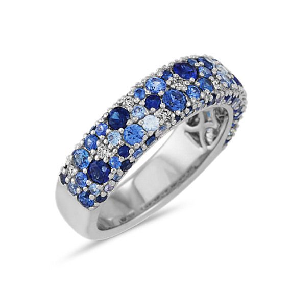 Mosaic Blue Sapphire & Diamond Ring (4mm) | Shane Co. White Gold Multi-stone Sapphire Ring, White Gold Multi-stone Sapphire Ring With Round Cut, Blue Diamond Half Eternity Ring, Luxury Blue Diamond Ring With Pave Setting, Blue Sapphire Ring With Diamond Accents For Promise, Blue Multi-stone Sapphire Ring, Blue Multi-stone Cluster Ring, Blue Sapphire Gemstone Ring In Platinum, Blue Sapphire Half Eternity Ring In Cubic Zirconia