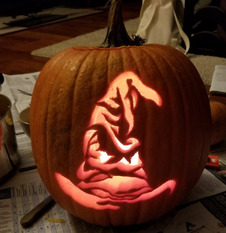 a pumpkin carved to look like a cat