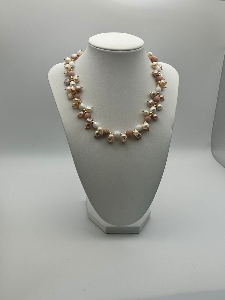 If you're in search of a timeless necklace, your search ends here. Consider the everlasting elegance of pearls - ideal for every occasion, be it anniversaries, weddings, formal events, a spring afternoon ensemble, or a night out. This particular piece promises to surpass your expectations. This necklace is an exquisite composition of delicate blush tones and creamy whites, designed to add a touch of feminine elegance to any outfit. It features an array of pearls and semi-precious stones in soft Elegant Round Pearl Chain Beaded Necklace, Luxury Pearl Necklaces With Round Beads, Elegant Pearl Chain Beaded Necklace, Single Strand Pearl Necklaces With Round Beads, Elegant Baroque Pearl Beaded Necklaces With Round Beads, Elegant Pearl White Round Beaded Necklace, Formal Pearl Beaded Necklaces With Pearl Drop, Elegant Baroque Pearl Beaded Necklaces, Formal Pearl Drop Beaded Necklace