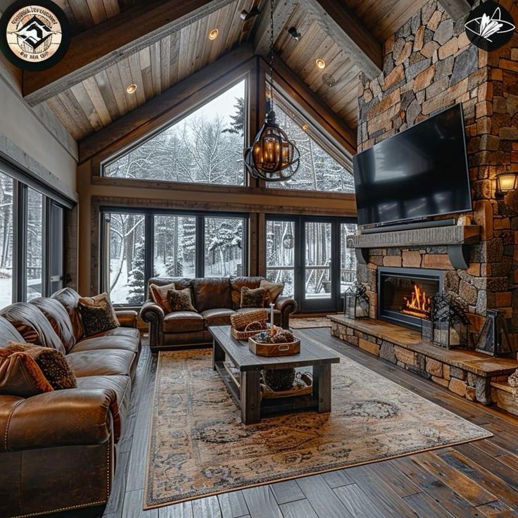 a living room filled with furniture and a flat screen tv mounted to the side of a fireplace