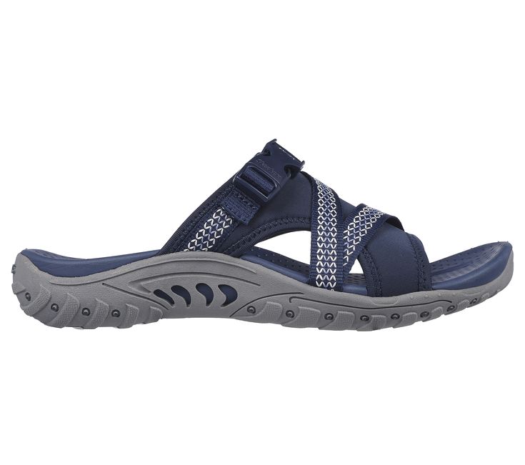 Explore the great outdoors in boundless comfort with Skechers Reggae - Slide Thru. This trail slide sandal features a webbing strap and neoprene fabric upper with a quick release buckle and a cushioned comfort footbed. | Skechers Women's Reggae - Slide through Sandals Outdoor Slide Sport Sandals With Cushioned Footbed, Synthetic Slide Sport Sandals For Outdoor, Slide Sandals With Arch Support For Outdoor Activities, Slide Sandals With Arch Support For Outdoor, Outdoor Synthetic Slide Sport Sandals, Adjustable Cushioned Slides For Outdoor Activities, Cushioned Slide Sport Sandals For Outdoor Activities, Open Toe Slides With Removable Insole For Outdoor Activities, Outdoor Synthetic Slides With Arch Support