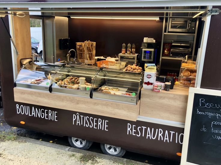 the food truck is selling pastries and breads