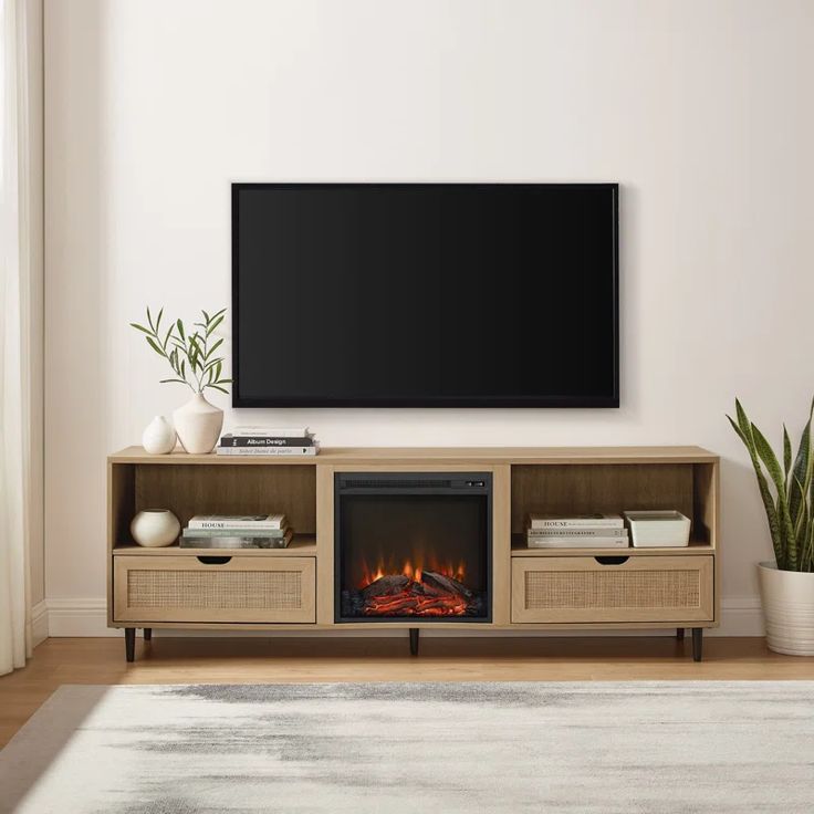 a living room with a television and fireplace