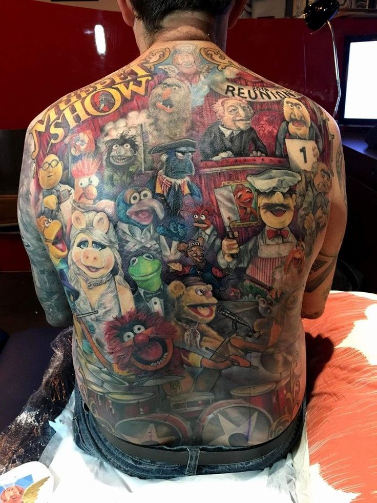 the back of a man's upper half with tattoos on his body and various movie characters