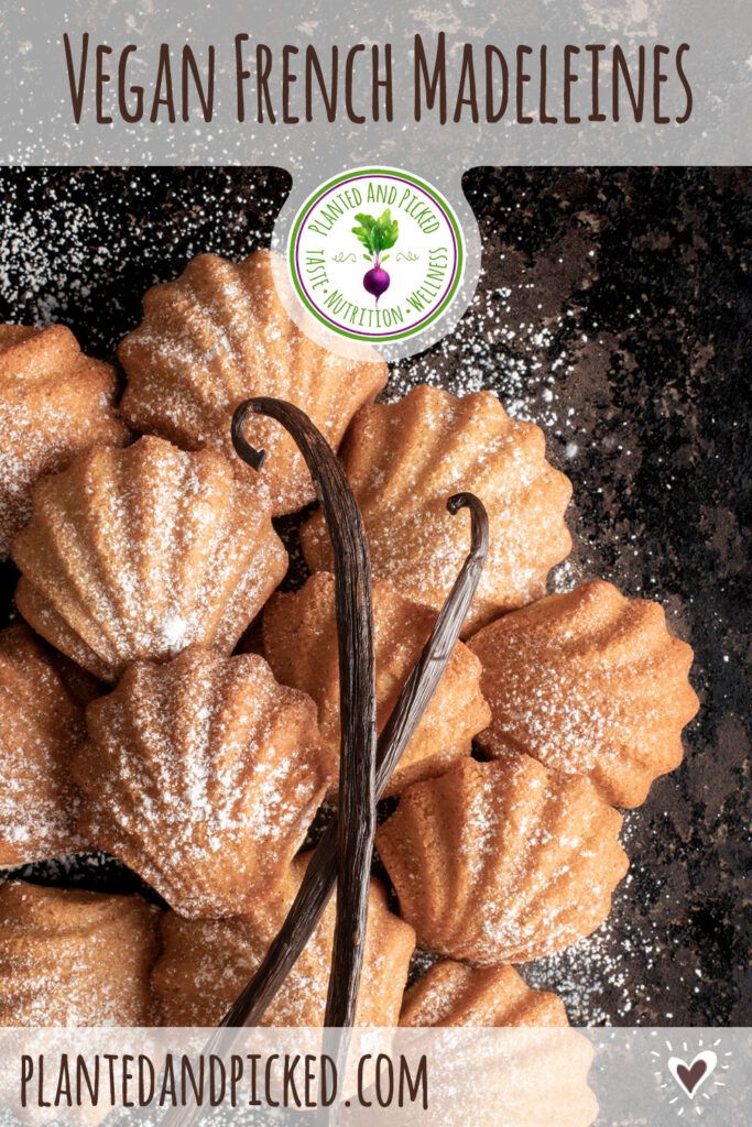 a bunch of pastries sitting on top of a table next to some powdered sugar