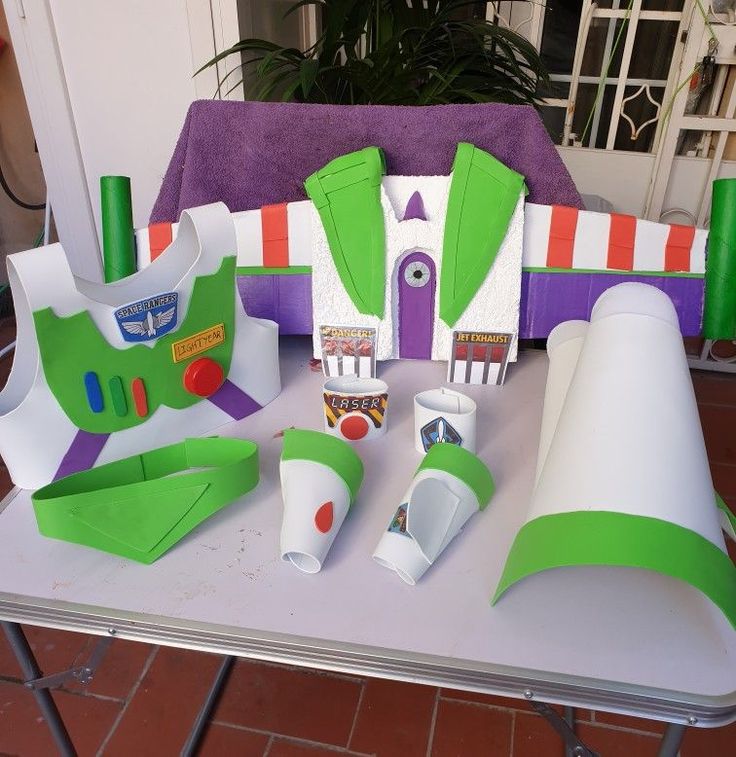 a table topped with paper cut outs and decorations