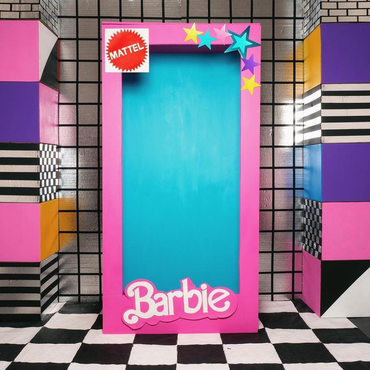 the barbie bathroom is decorated in pink, blue and purple with stars on the door