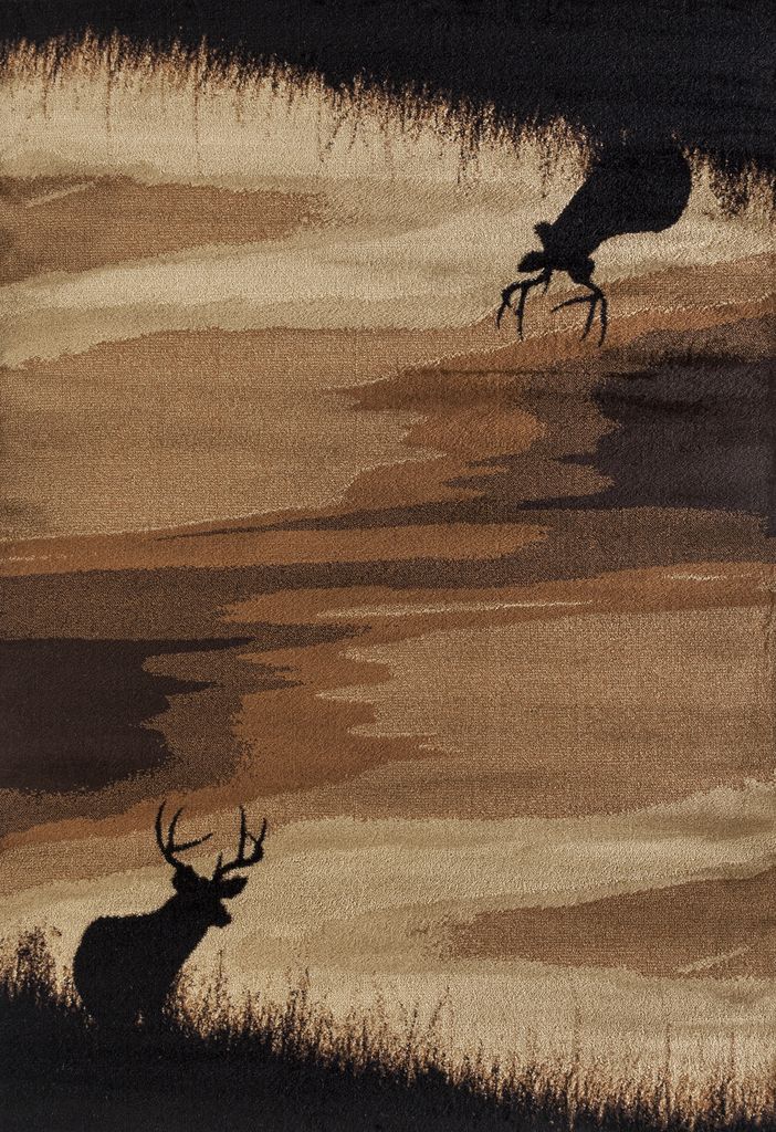 two deer walking across a field next to tall grass on a sunny day with brown and black colors