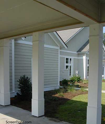 an outside view of a white house with columns