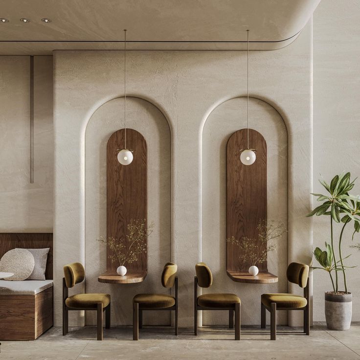 a room with chairs, tables and mirrors on the wall next to a plant in a pot