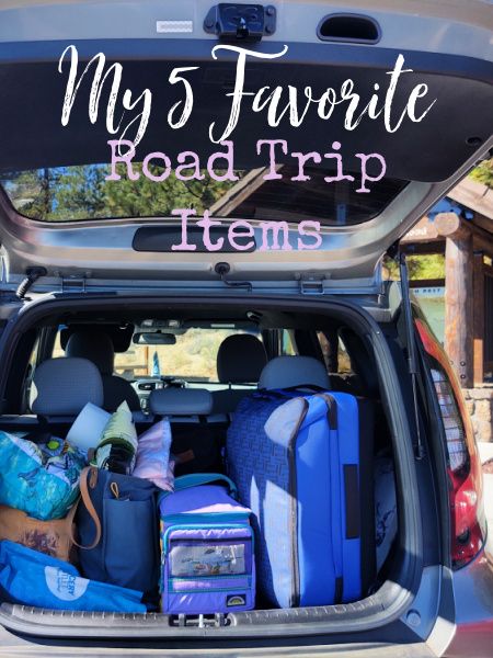 the back of a car with luggage packed in it and text overlay that reads, my 5 favorite road trip items