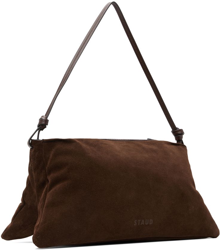 Suede shoulder bag in brown. · Knotted detailing at fixed shoulder strap · Logo embossed at back face · Zip closure · Zip pocket at interior · Suede lining · H7.75 x W15.5 x D6.25 Supplier color: Mahogany Brown Pouch Baguette Bag With Dust Bag, Staud Rectangular Formal Shoulder Bag, Staud Formal Rectangular Shoulder Bag, Formal Rectangular Staud Shoulder Bag, Staud Rectangular Bag With Removable Pouch, Staud Luxury Bag With Removable Pouch, Staud Luxury Leather Shoulder Bag, Luxury Staud Shoulder Bag With Removable Pouch, Staud Formal Shoulder Bag