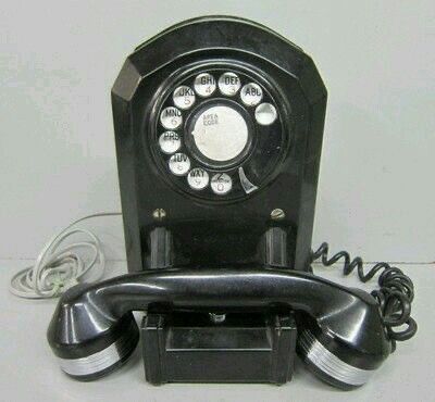 an old fashioned telephone is sitting on the table