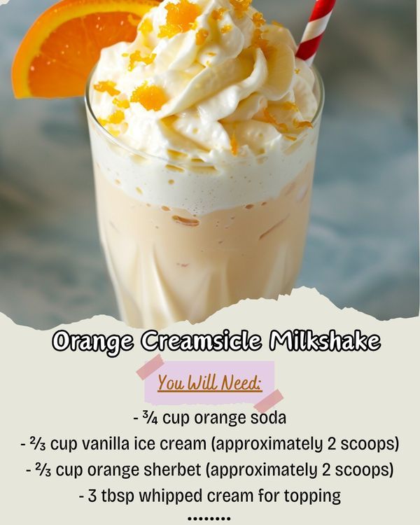 an orange creamsice milkshake with whipped cream